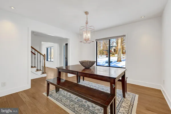 a living room with furniture a window and a dining table