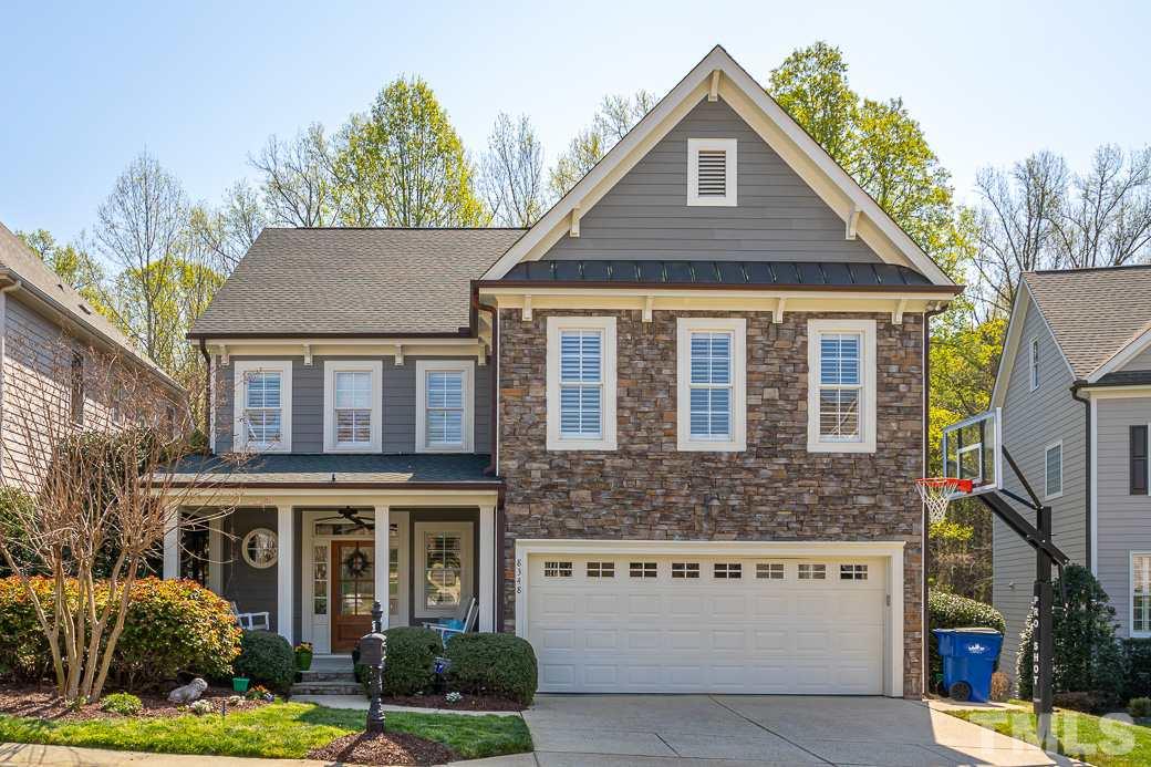 8348 Wheatstone Lane Raleigh, NC 27613 - Photo 1 of 9 a front view of a house with a yard
