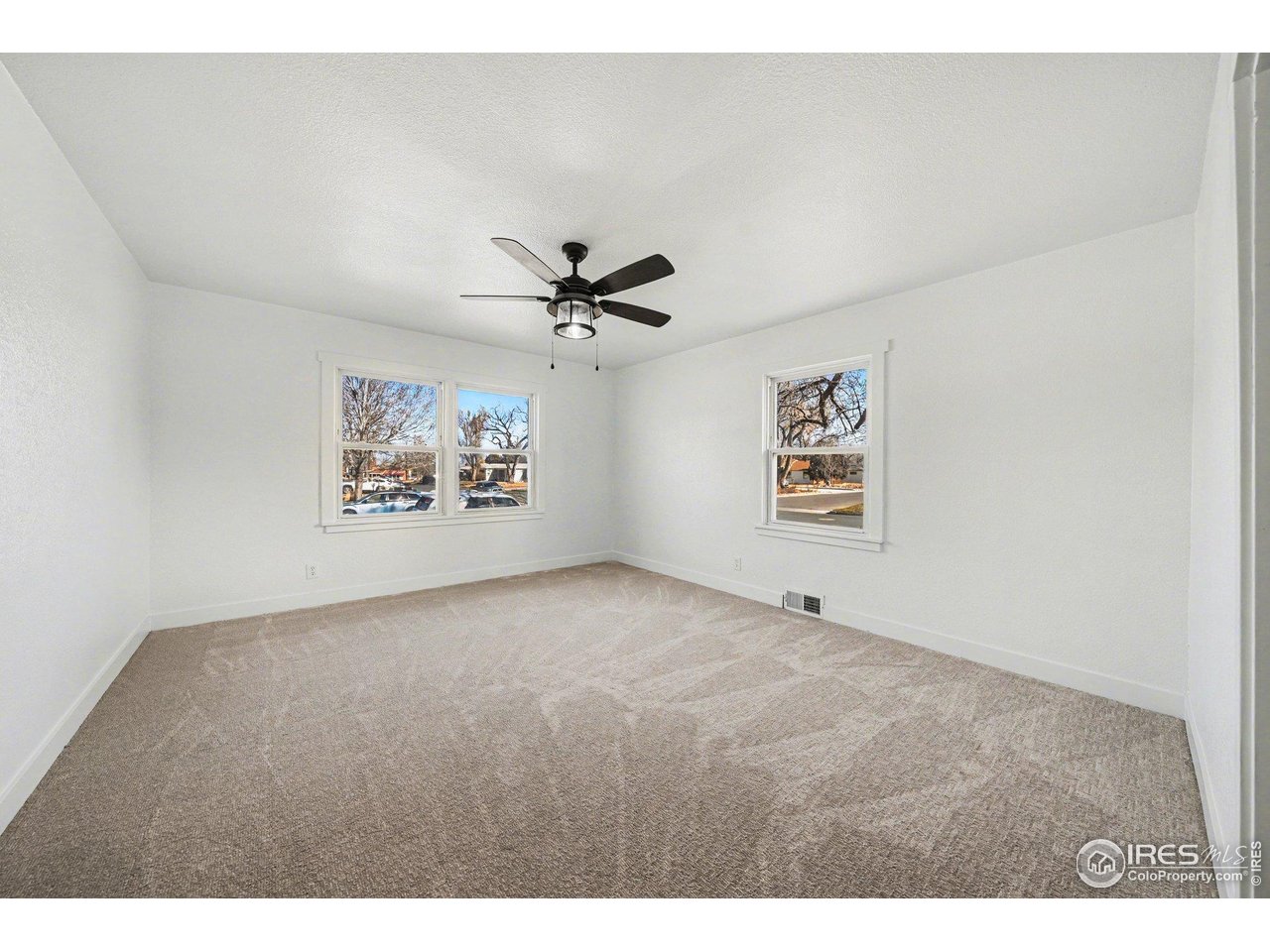 2202 17th Street Greeley, CO 80631 - Photo 16 of 36 a view of an empty room with a window