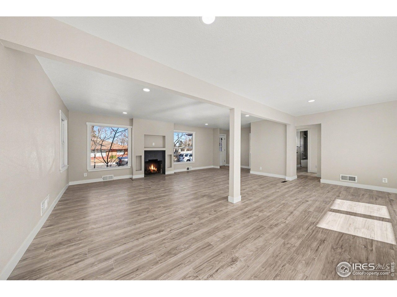 2202 17th Street Greeley, CO 80631 - Photo 6 of 36 a view of a livingroom with wooden floor
