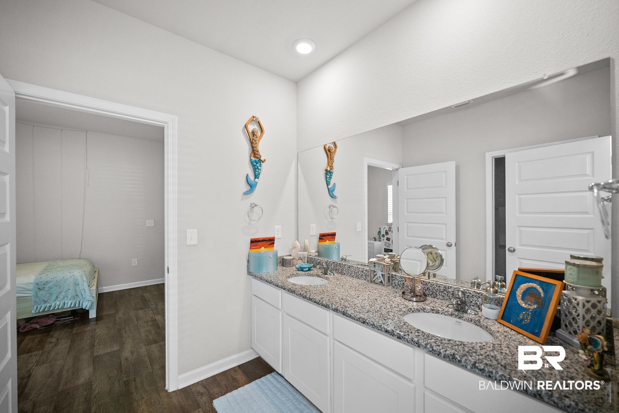 23997 Veranda Circle Elberta, AL 36530 - Photo 11 of 28 Spacious bathroom featuring a dual vanity with granite-finish countertop, undermount sinks, and a full-width mirror
