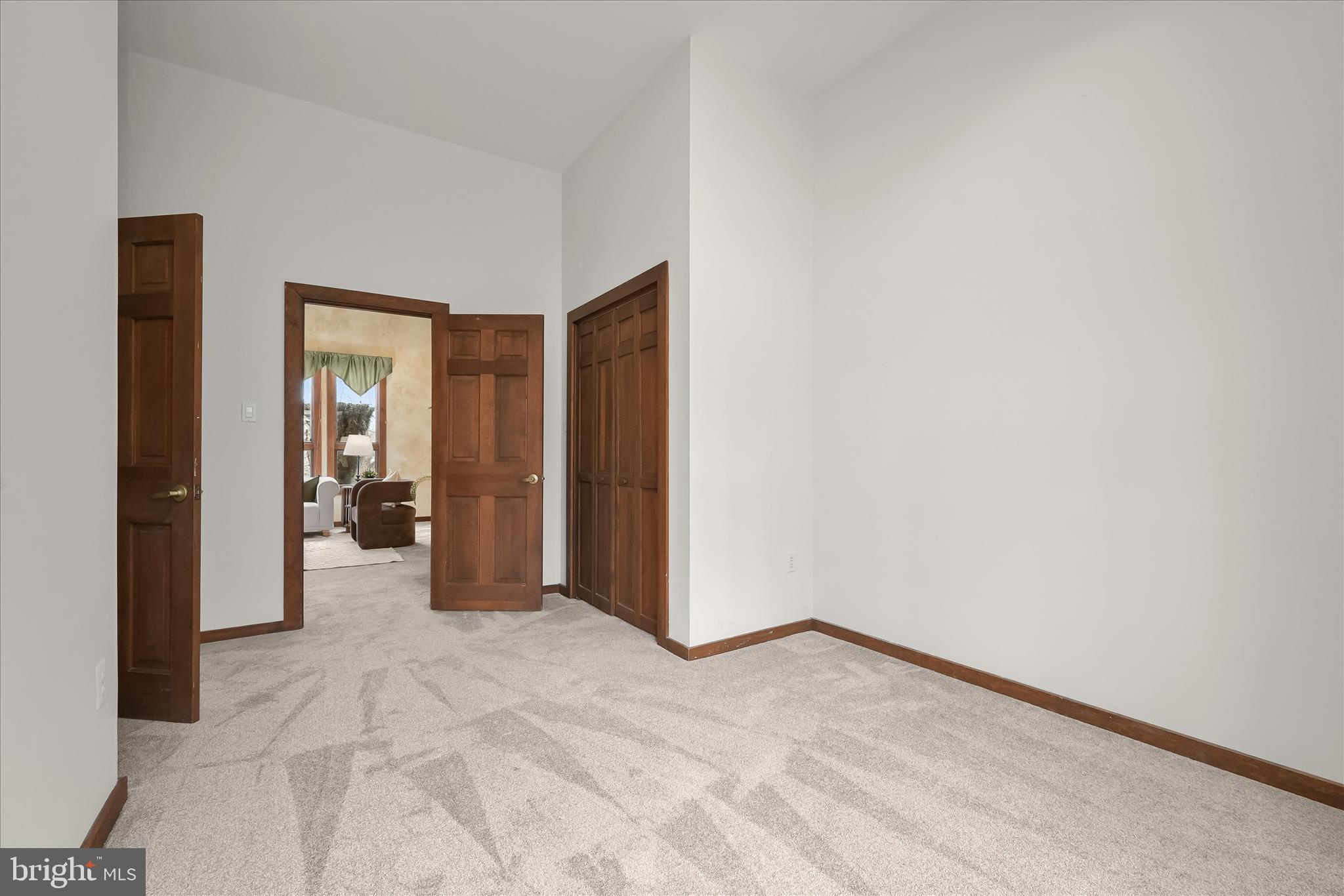 13304 Ridgewood Drive Ellicott City, MD 21042 - Photo 59 of 95 a view of a hallway with wooden shelves