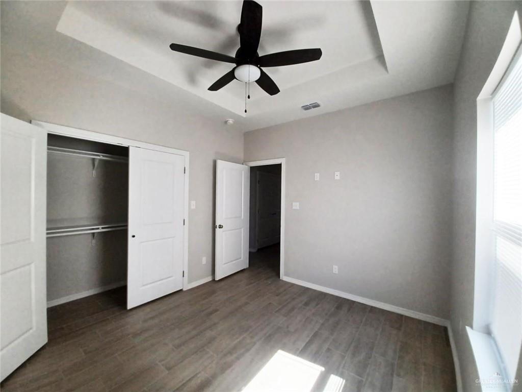 1506 Playa Drive, Unit 1 Weslaco, TX 78596 - Photo 6 of 9 a view of a refrigerator in kitchen and an empty room