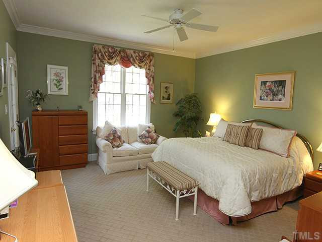 3404 Sir Colleton Court Raleigh, NC 27612 - Photo 13 of 25 Big first floor master bedroom--access to the screened porch is at door in the back left side of the picture. The doors from the porch to the master and living room have high-quality, triple-locked storm doors for added security. Master Suite