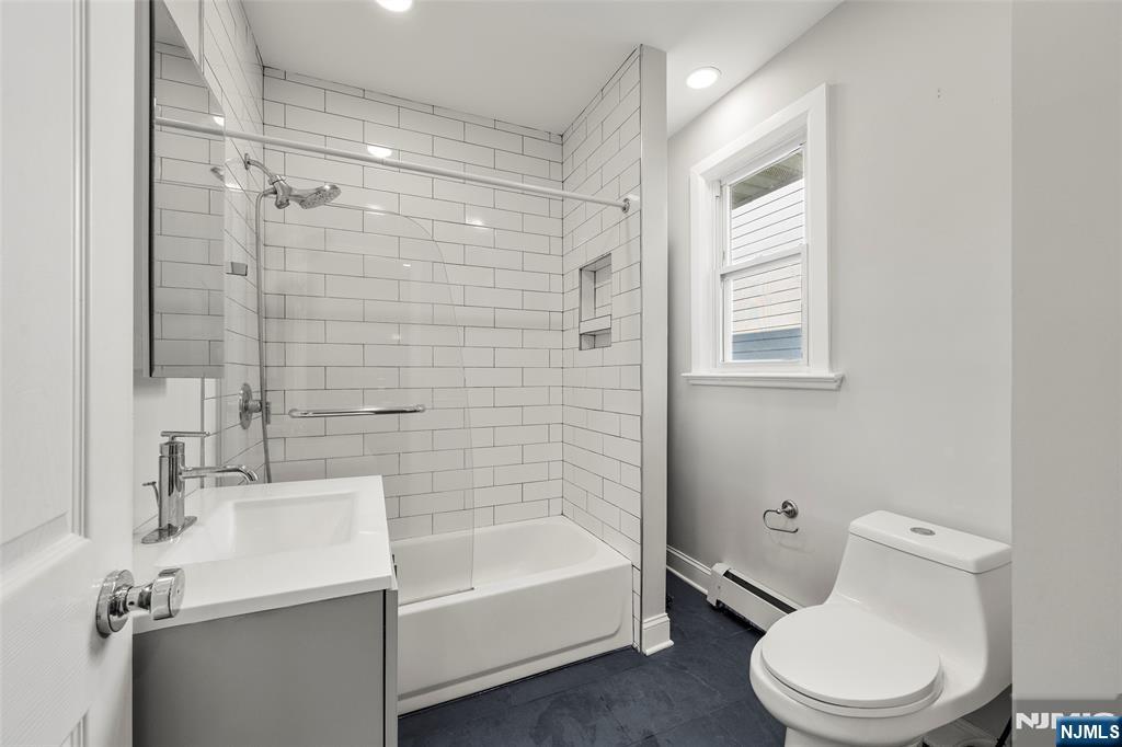 267 Hirliman Road Englewood, NJ 07631 - Photo 11 of 16 a bathroom with a sink toilet and shower