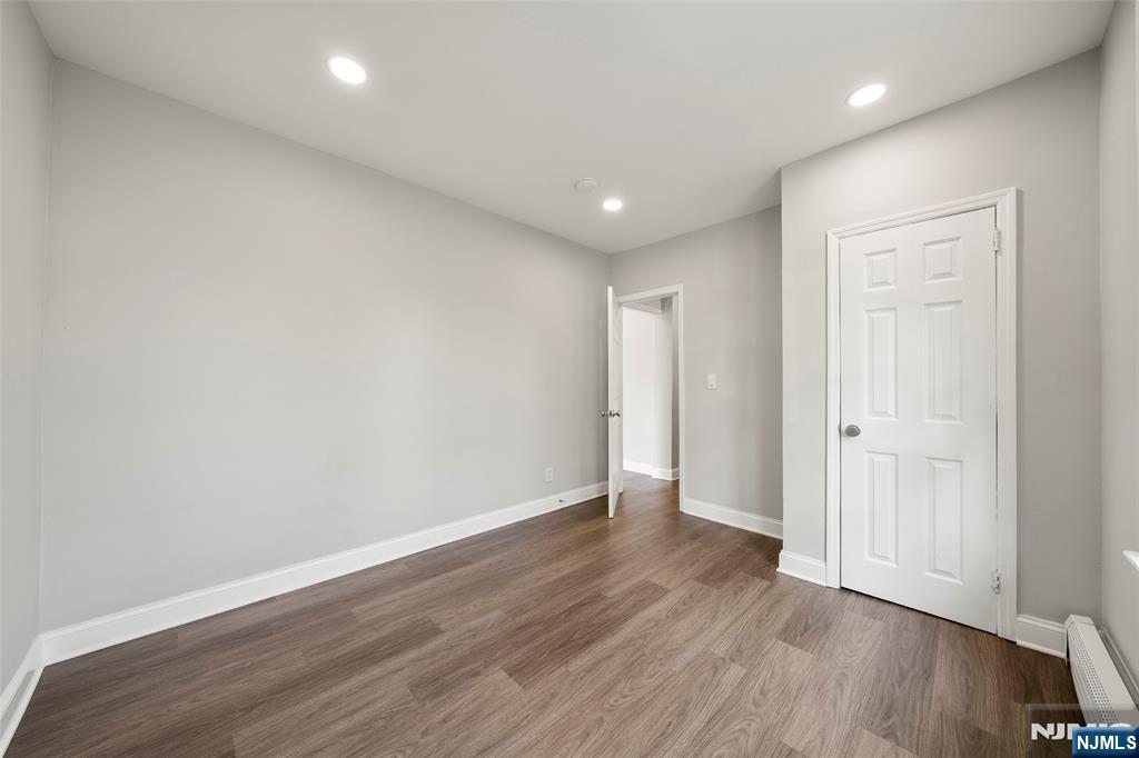 267 Hirliman Road Englewood, NJ 07631 - Photo 13 of 16 a view of an empty room with wooden floor