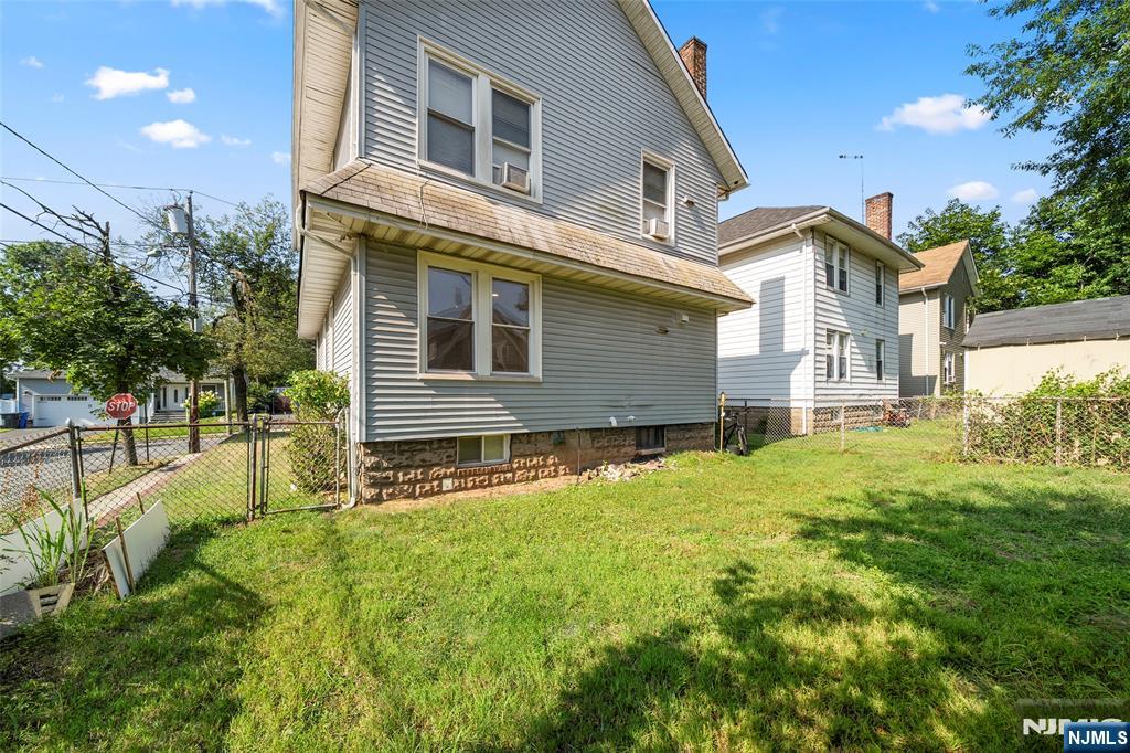 267 Hirliman Road Englewood, NJ 07631 - Photo 15 of 16 a front view of a house with a yard