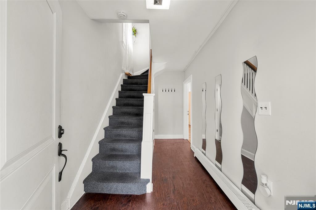 267 Hirliman Road Englewood, NJ 07631 - Photo 3 of 16 a view of entryway with wooden floor and stairs