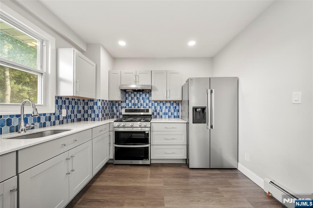 267 Hirliman Road Englewood, NJ 07631 - Photo 6 of 16 a kitchen with a refrigerator and a sink