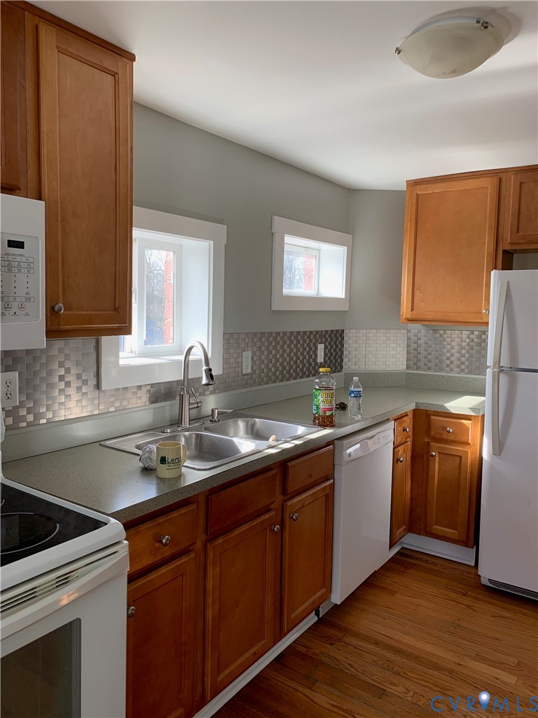 1002 Main Street Dillwyn, VA 23936 - Photo 3 of 16 a kitchen with stainless steel appliances granite countertop a sink stove and refrigerator