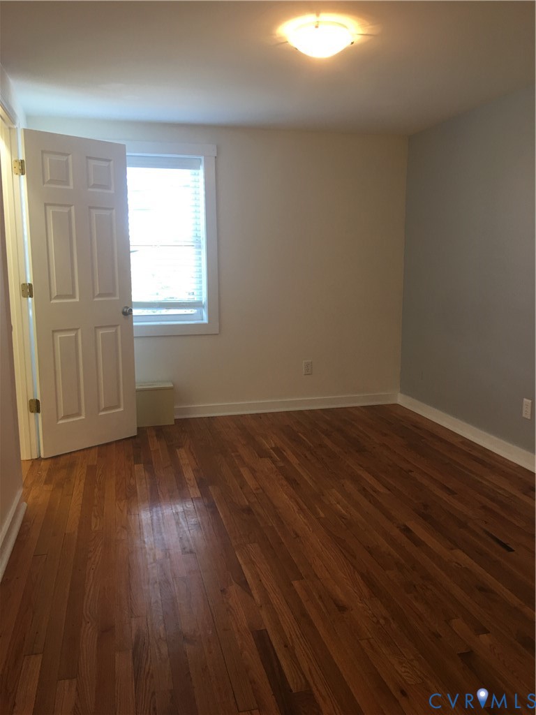 1002 Main Street Dillwyn, VA 23936 - Photo 5 of 16 a view of a room with wooden floor and windows