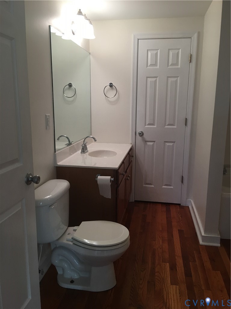 1002 Main Street Dillwyn, VA 23936 - Photo 10 of 16 a bathroom with a toilet a sink and mirror