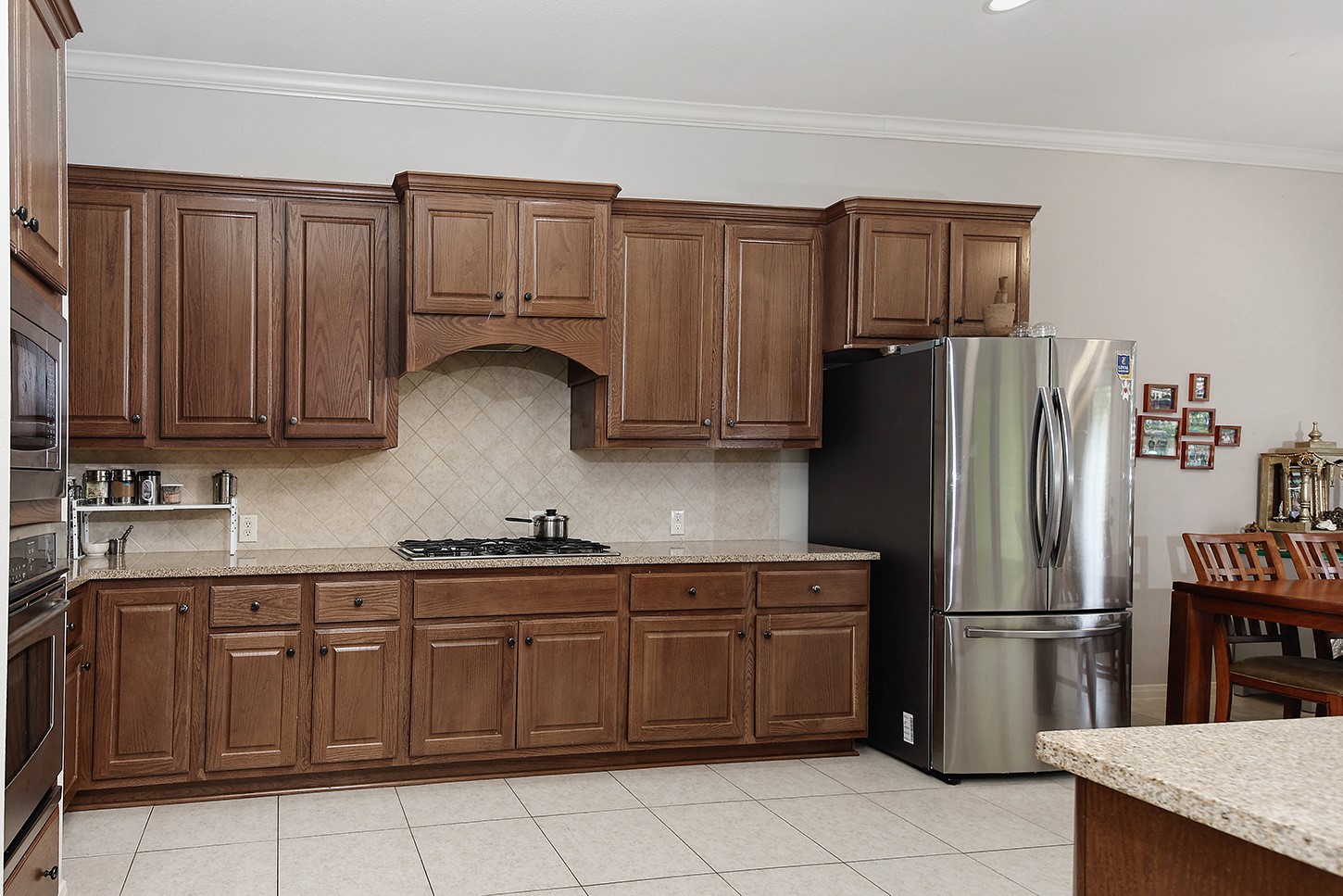 18722 Duke Lake Drive Spring, TX 77388 - Photo 10 of 26 a kitchen with stainless steel appliances granite countertop a refrigerator and a stove top oven