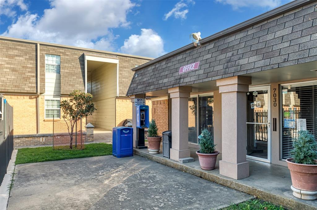 7064 Glenview Drive, Unit 92 North Richland Hills, TX 76180 - Photo 2 of 11 a view of a porch with potted plants