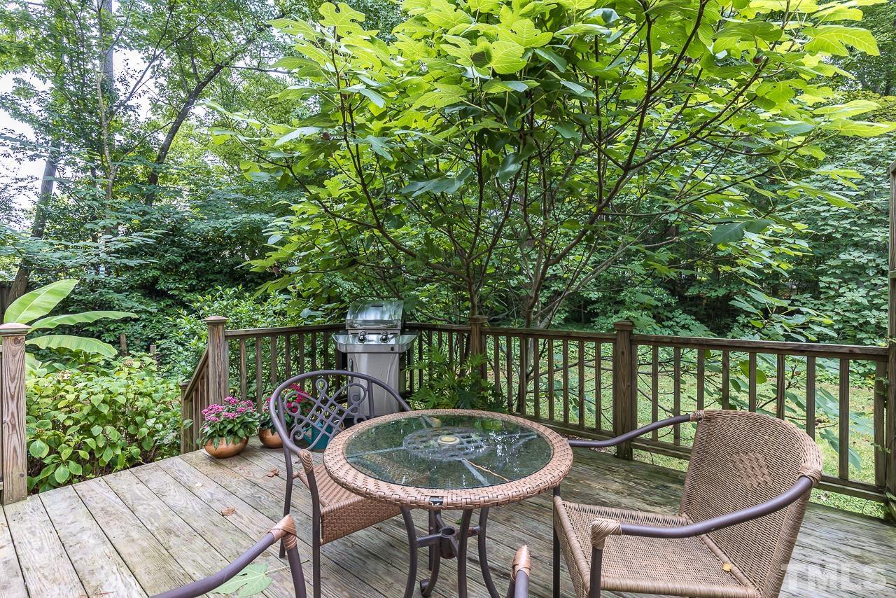 7309 Glendower Road Raleigh, NC 27613 - Photo 13 of 19 a patio with a yard table and chairs