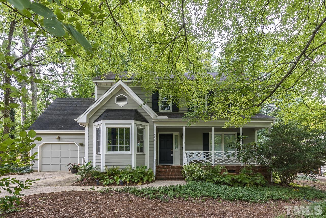 7309 Glendower Road Raleigh, NC 27613 - Photo 2 of 19 a front view of a house with garden