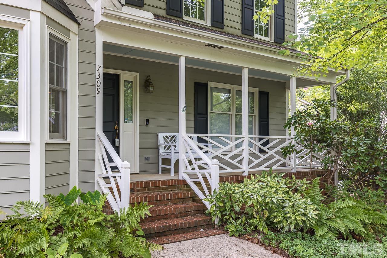 7309 Glendower Road Raleigh, NC 27613 - Photo 3 of 19 front view of a house with a bench