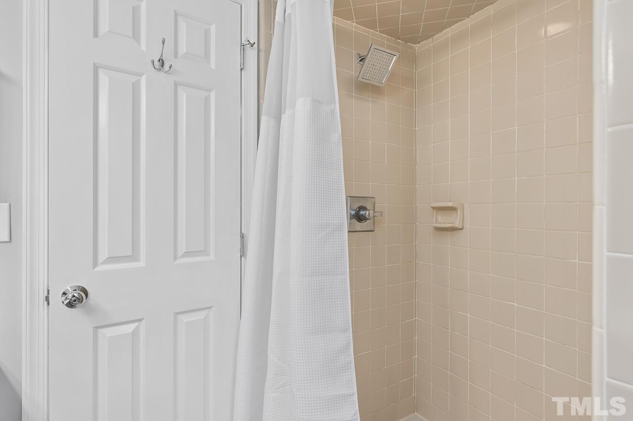 7309 Glendower Road Raleigh, NC 27613 - Photo 9 of 19 a bathroom with a shower