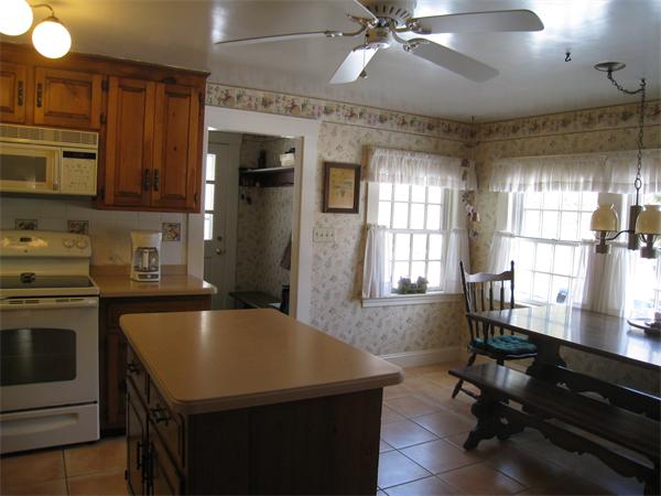 207 Cordaville Road Ashland, MA 01721 - Photo 5 of 29 a kitchen with a table chairs and refrigerator
