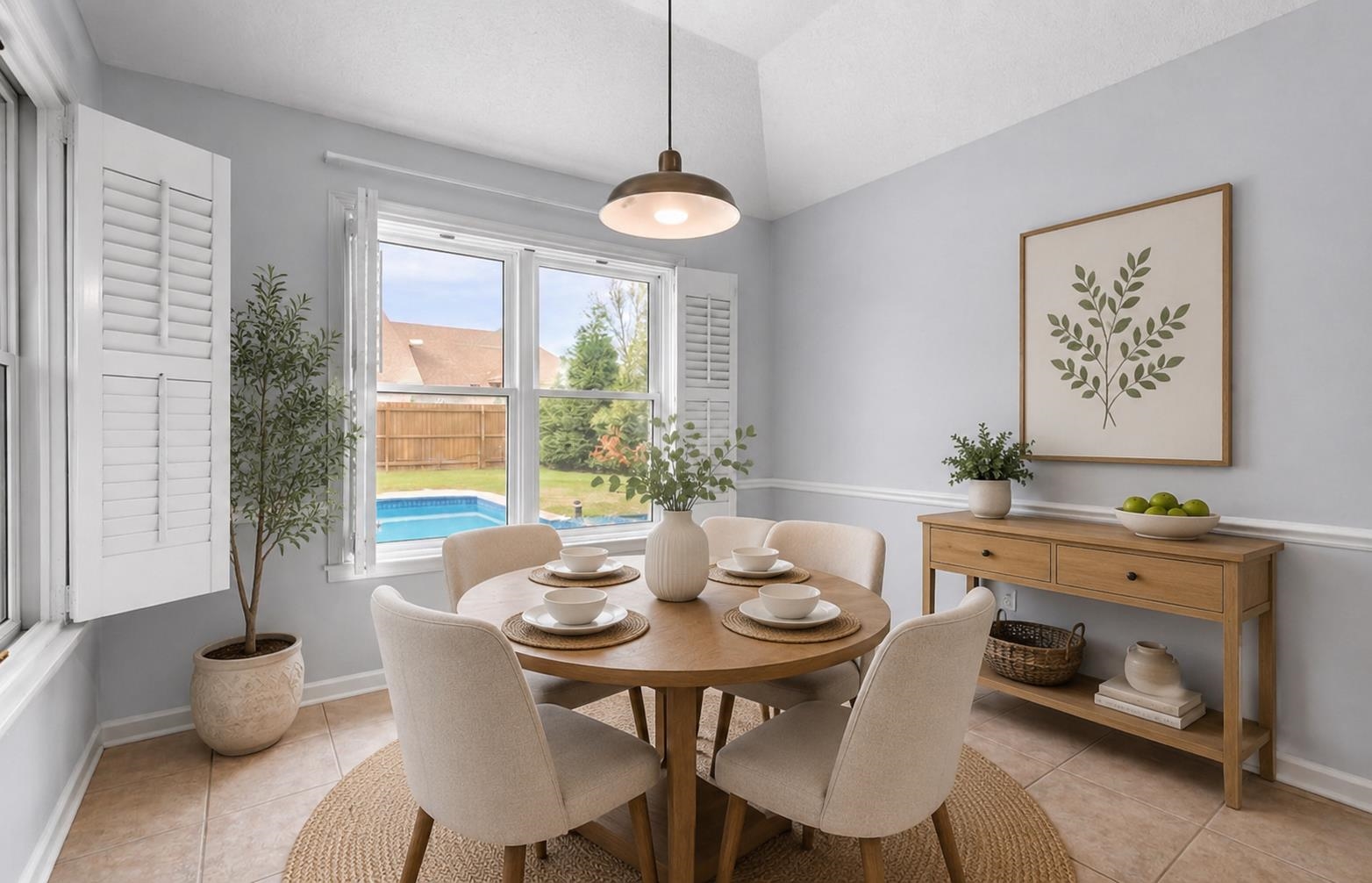 9333 Breakstone Cove Collierville, TN 38017 - Photo 15 of 40 Gather around in this bright and inviting breakfast room featuring abundant natural light, vaulted ceilings, and views of the backyard. The perfect spot for morning coffee, casual dining, and everyday moments with family and friends.