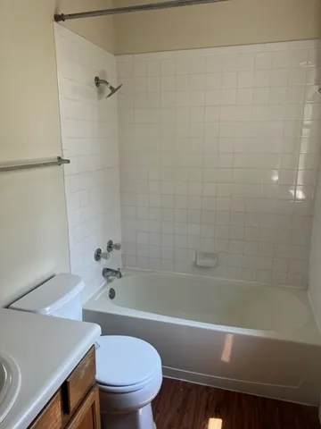 a bathroom with a bathtub and a toilet