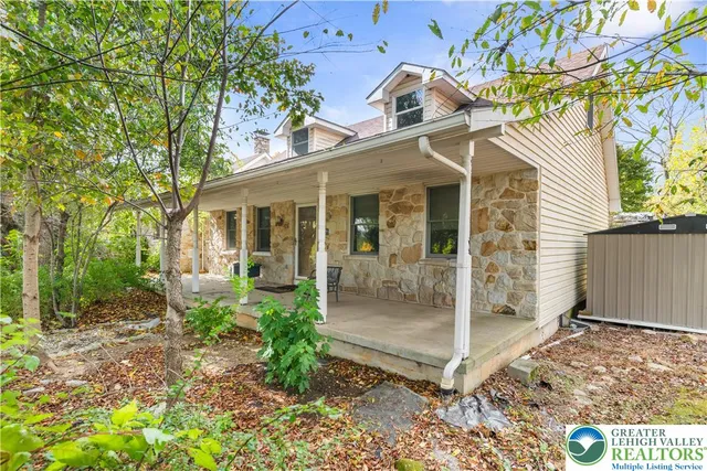 a front view of a house with a porch