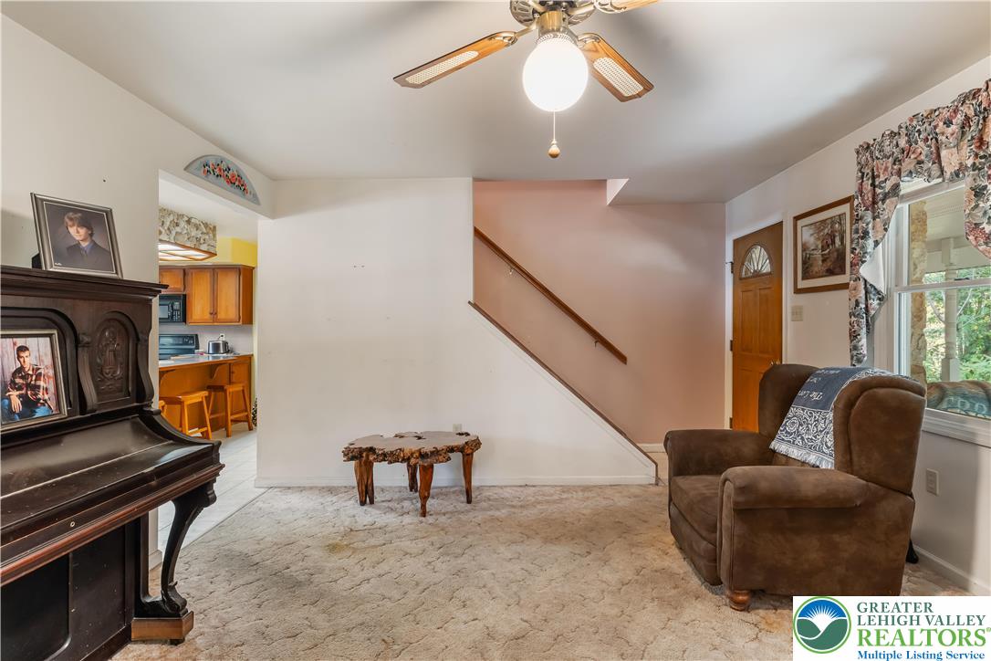 390 Long Lane Road Walnutport, PA 18088 - Photo 11 of 56 a living room with furniture and a piano