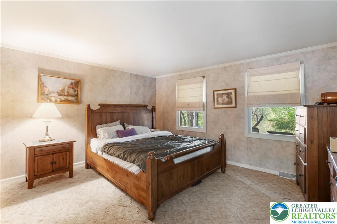 390 Long Lane Road Walnutport, PA 18088 - Photo 22 of 56 a bed sitting in a bedroom next to a window