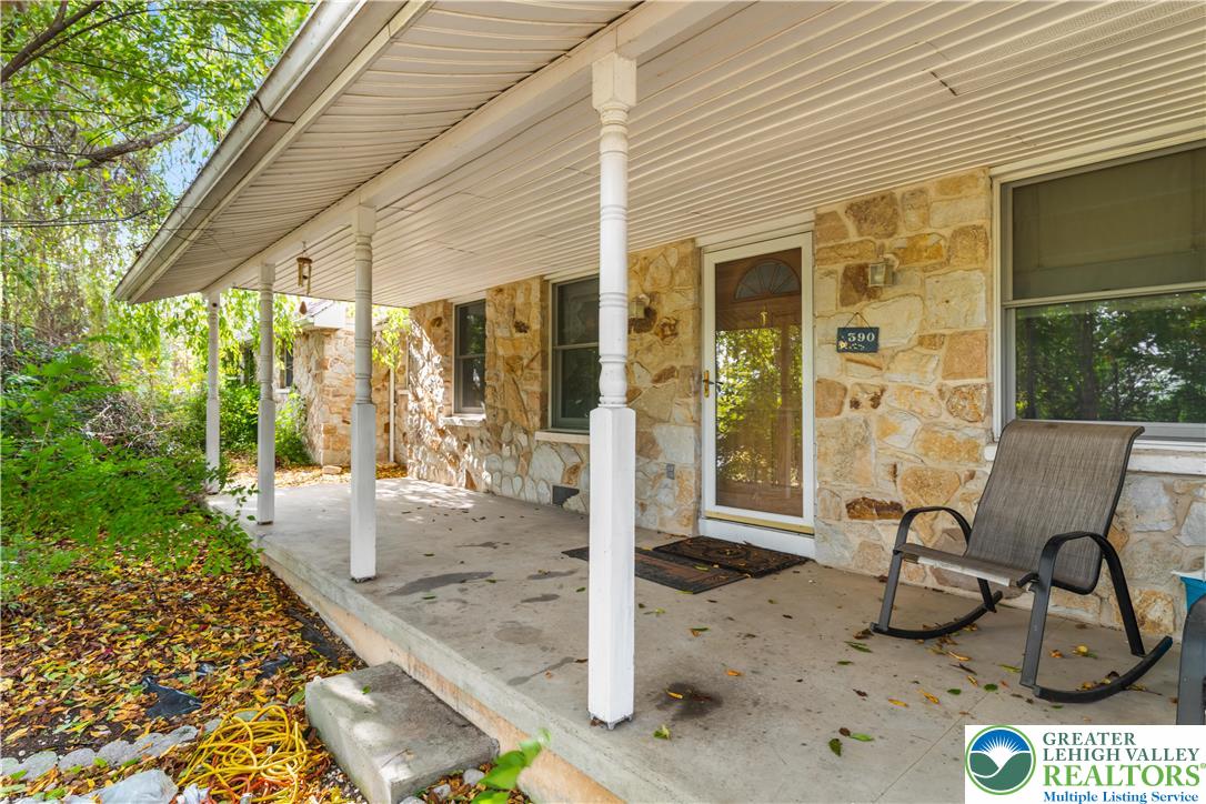 390 Long Lane Road Walnutport, PA 18088 - Photo 3 of 56 a view of a patio with table and chairs and potted plants