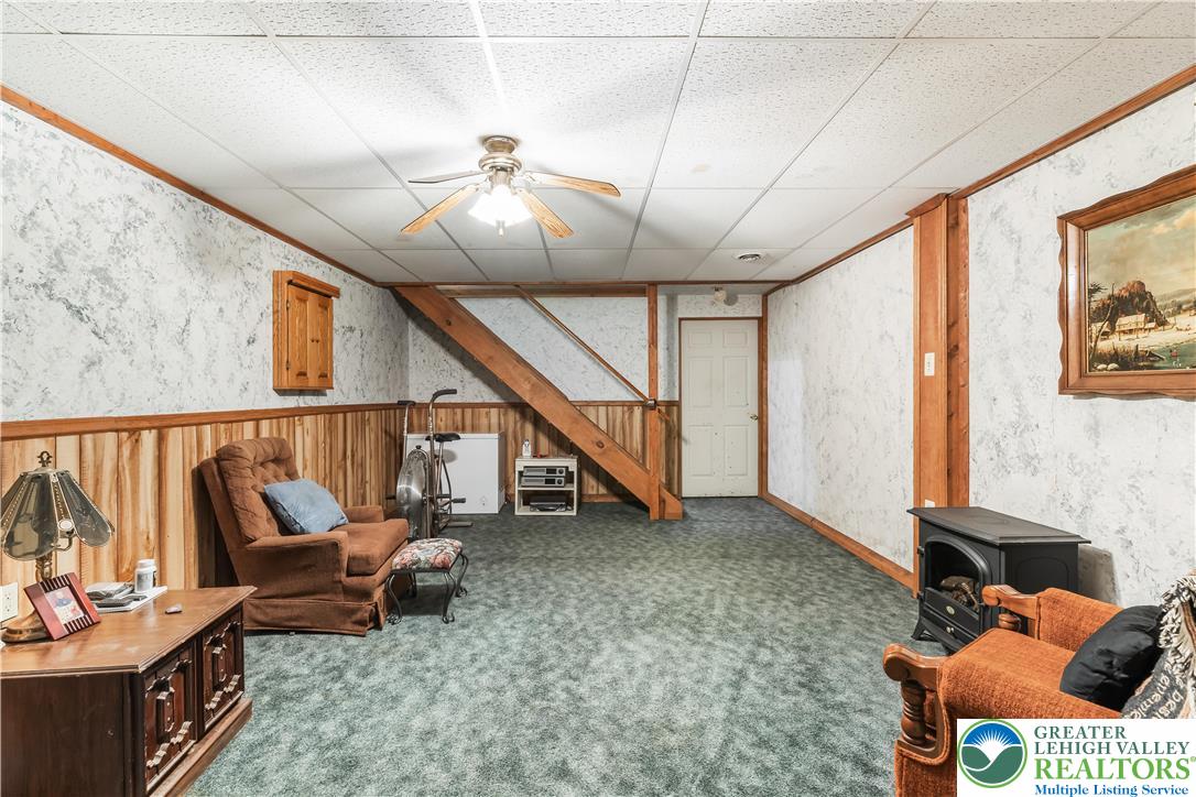 390 Long Lane Road Walnutport, PA 18088 - Photo 35 of 56 a living room with furniture and a flat screen tv