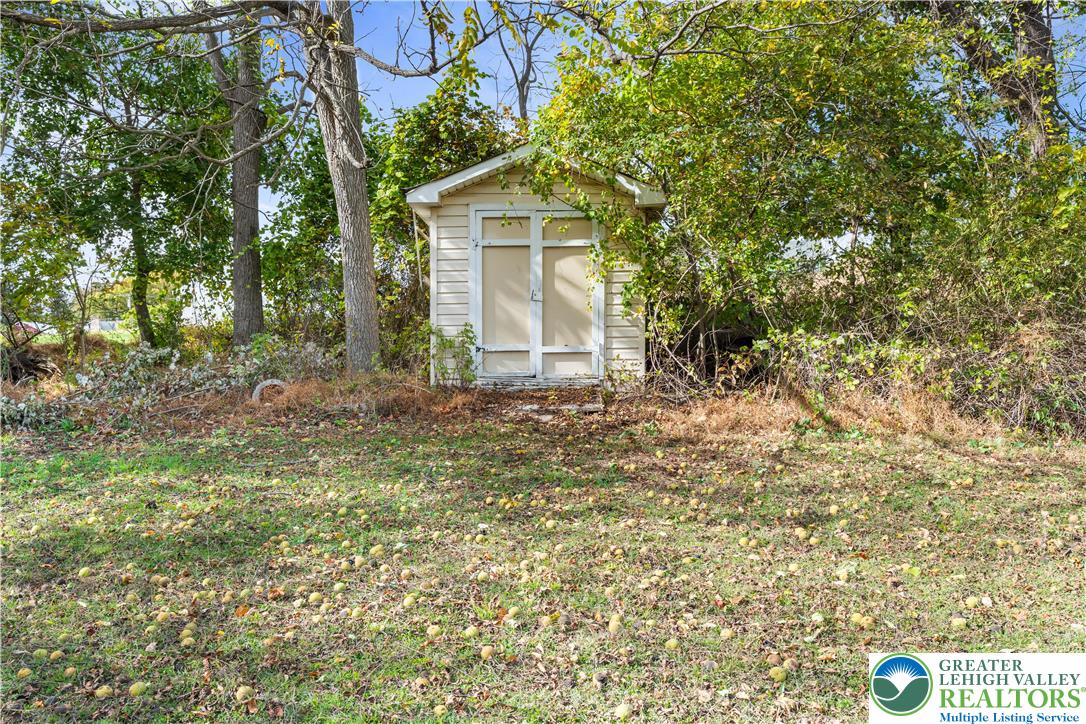 390 Long Lane Road Walnutport, PA 18088 - Photo 42 of 56 a front view of a house with a garden