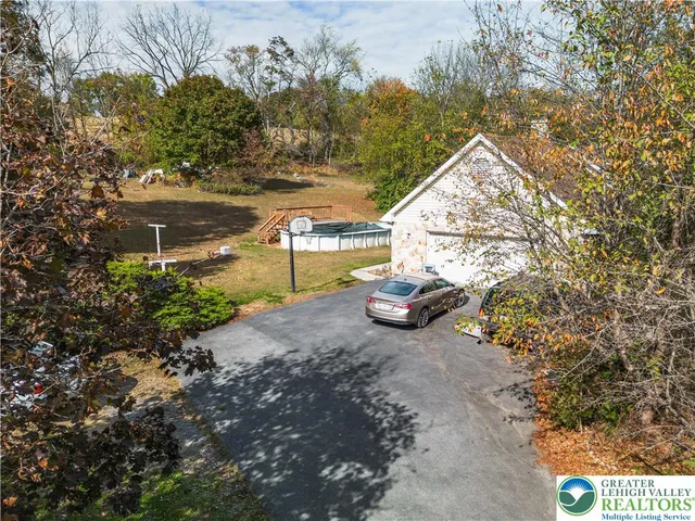 an aerial view of residential house with outdoor space and lake view