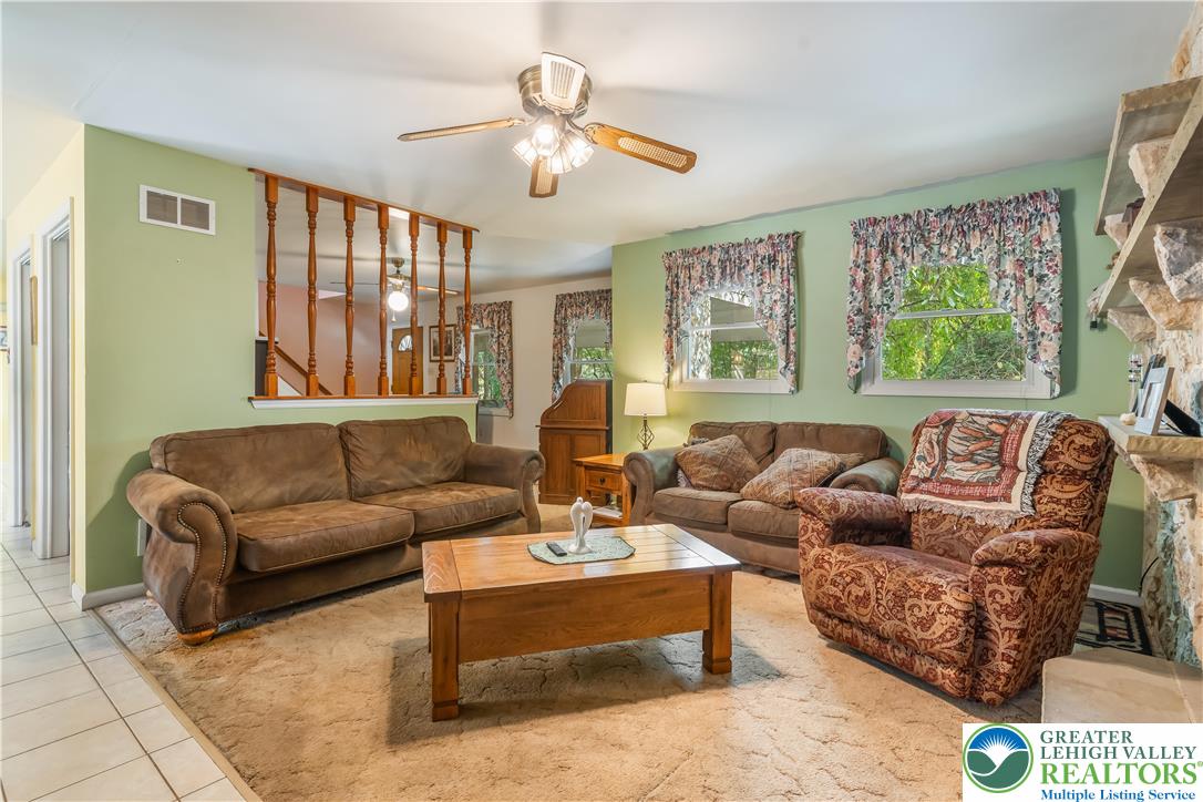 390 Long Lane Road Walnutport, PA 18088 - Photo 7 of 56 a living room with furniture and a large window
