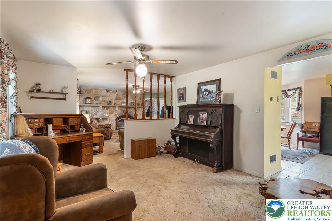 390 Long Lane Road Walnutport, PA 18088 - Photo 10 of 56 a living room with furniture kitchen view and a wooden floor