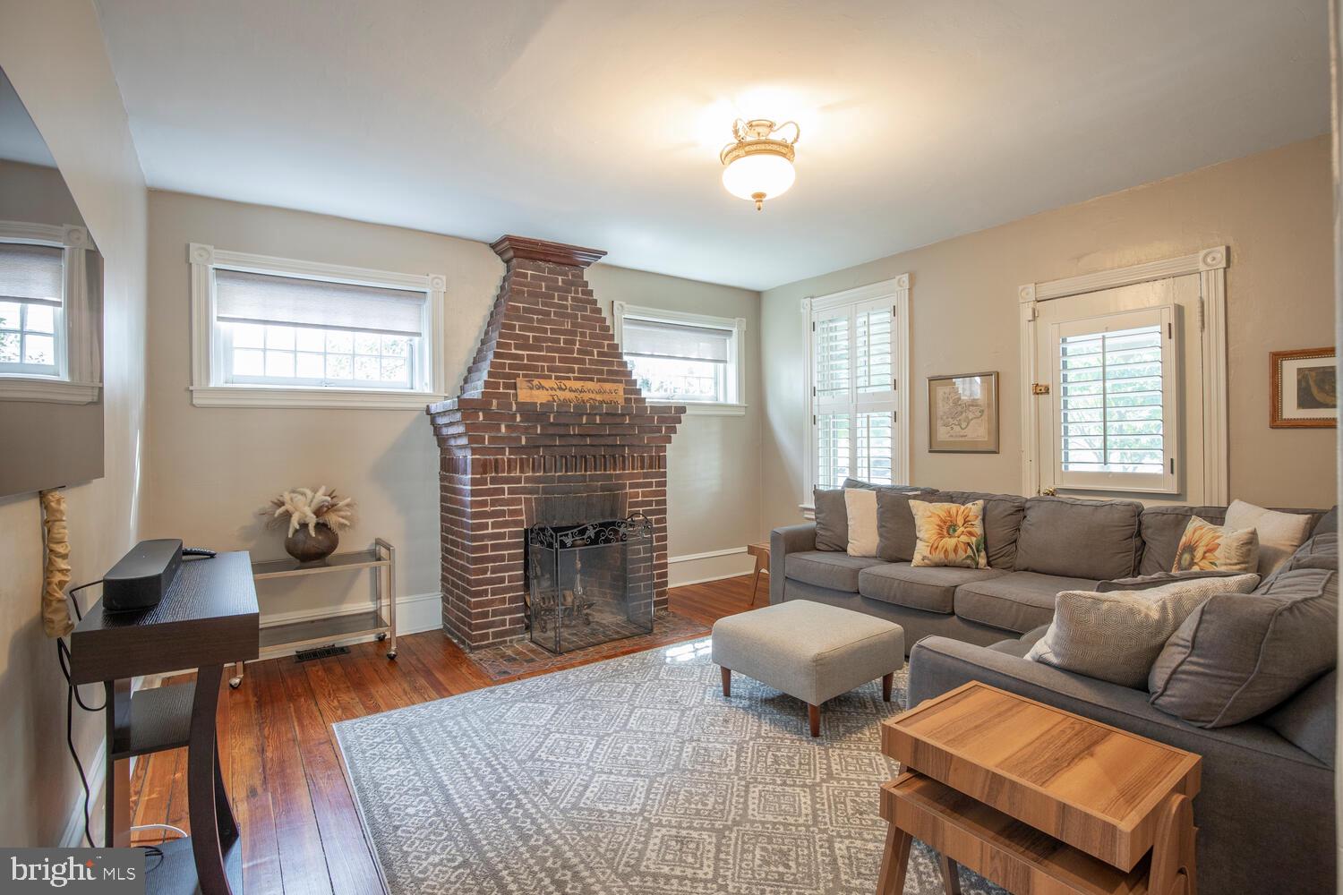 121 Cottage Street Doylestown, PA 18901 - Photo 15 of 46 a living room with furniture and a fireplace