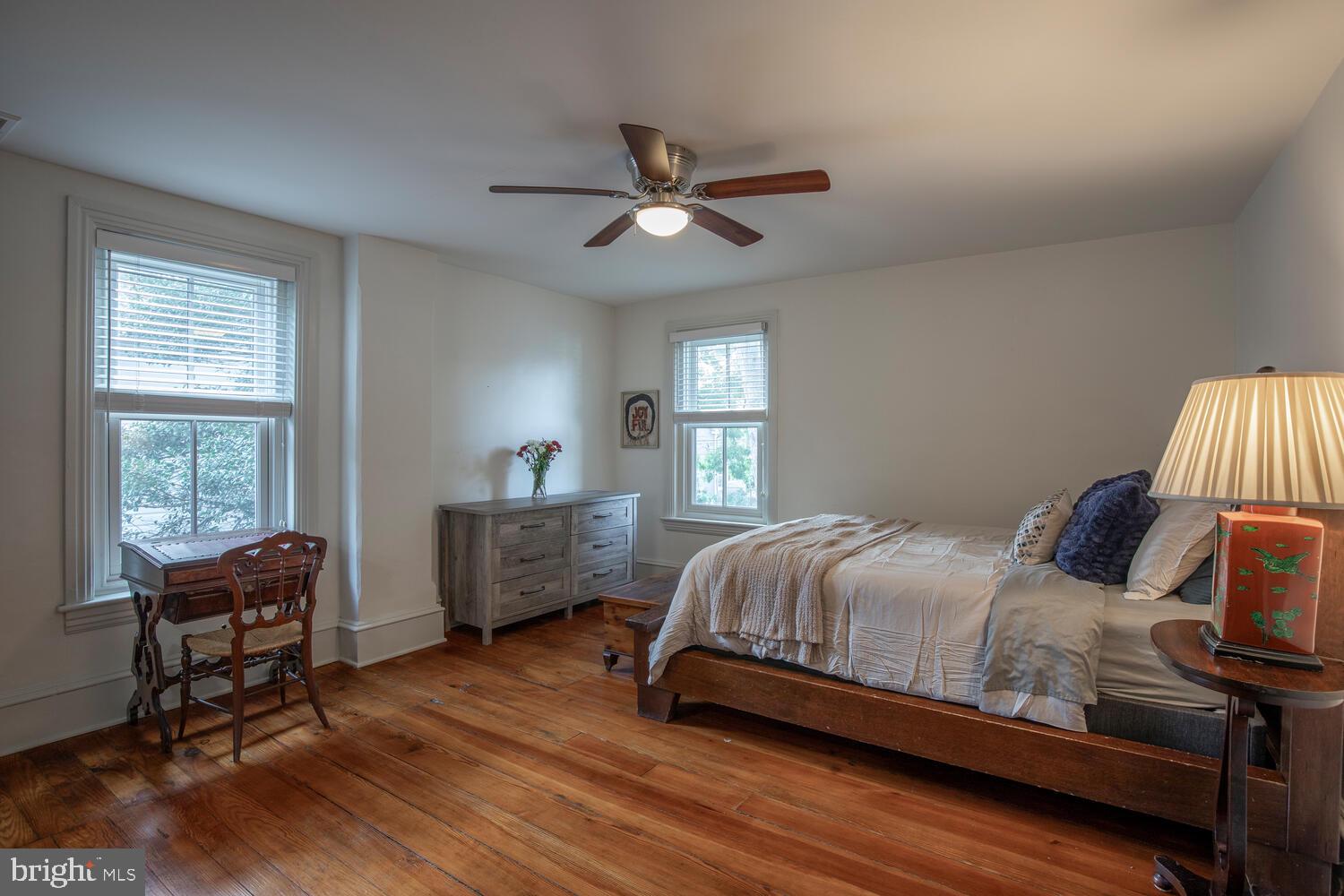 121 Cottage Street Doylestown, PA 18901 - Photo 26 of 46 a bedroom with a bed and wooden floor