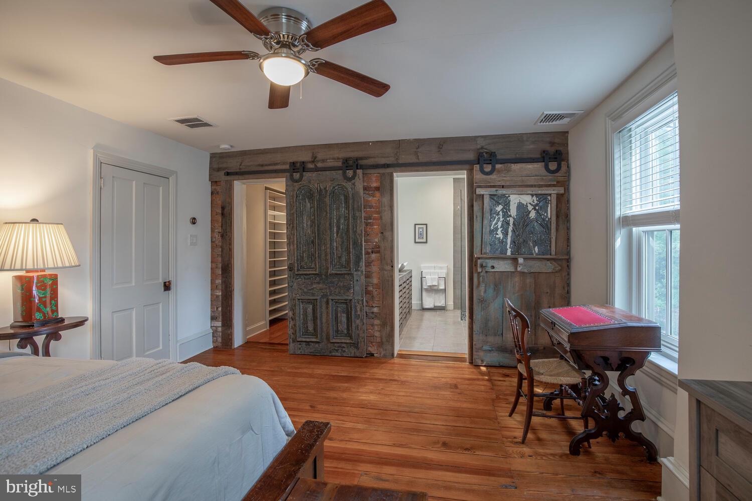 121 Cottage Street Doylestown, PA 18901 - Photo 29 of 46 a bedroom with bed and a chandelier