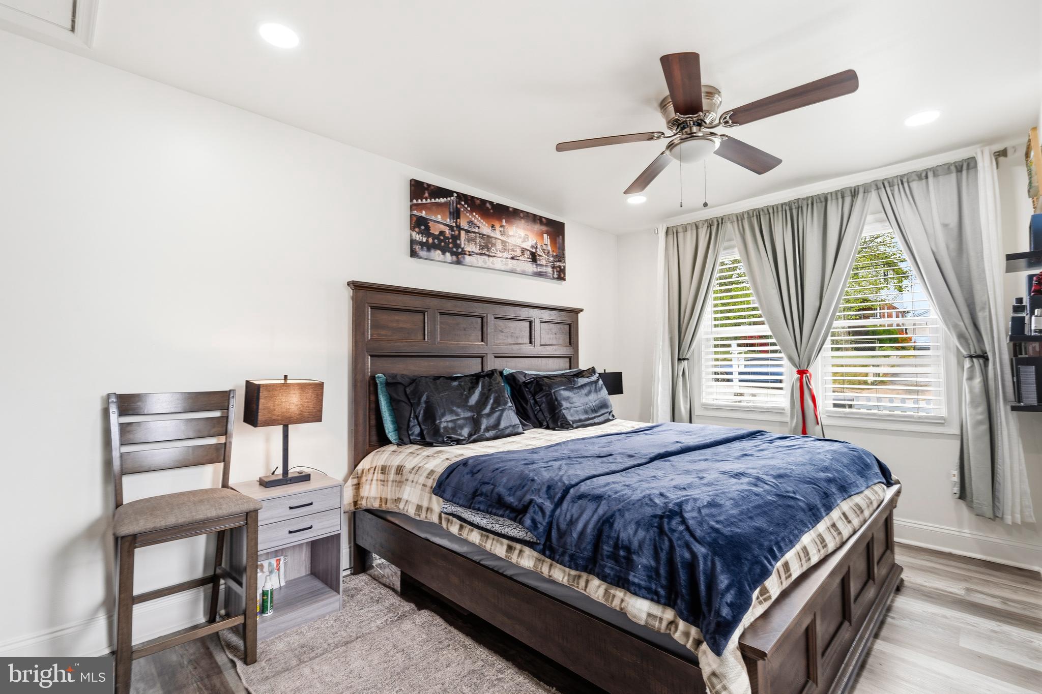 552 48th Street Baltimore, MD 21224 - Photo 13 of 29 a bedroom with a bed and a chandelier