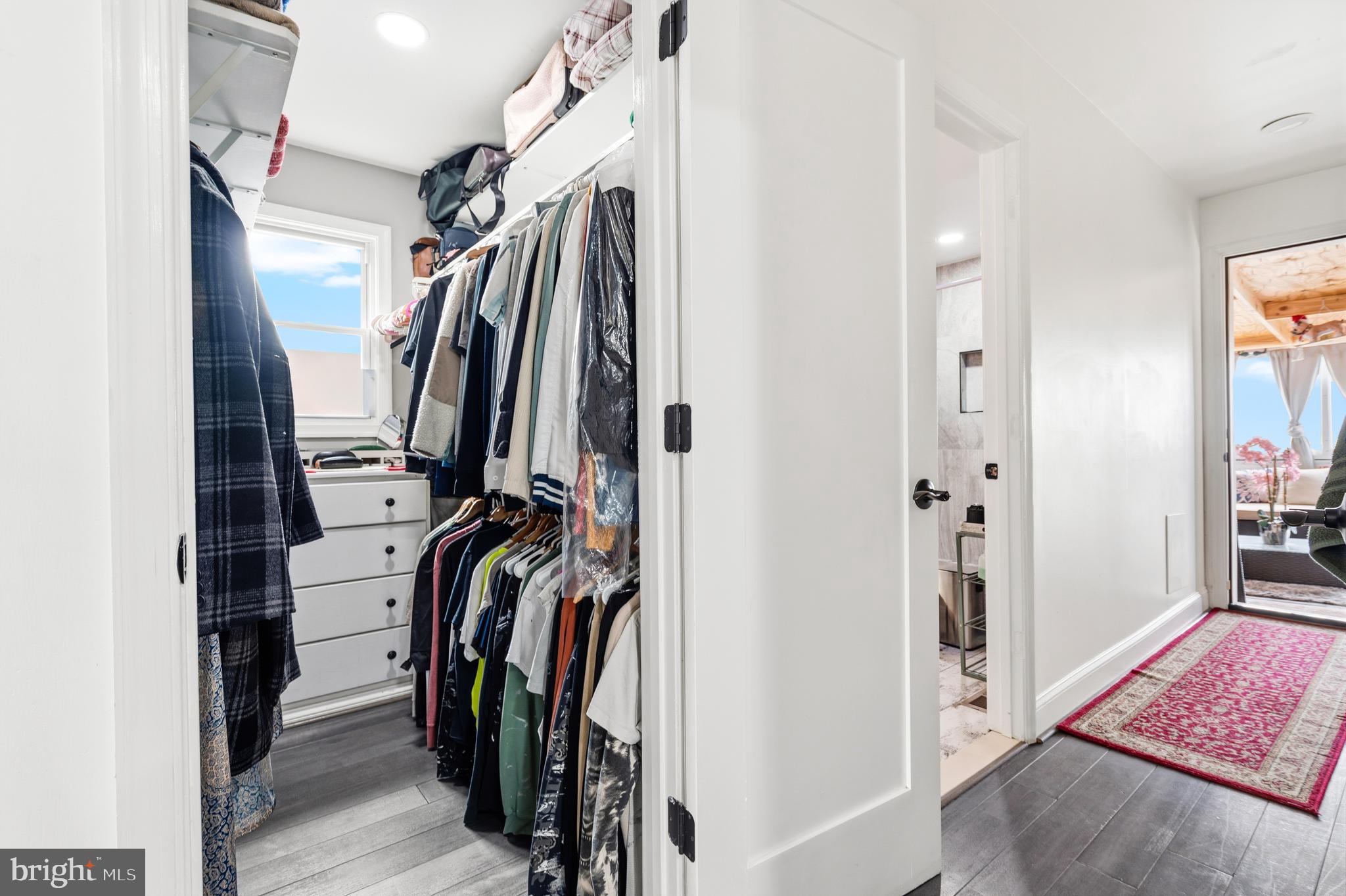 552 48th Street Baltimore, MD 21224 - Photo 14 of 29 a view of walk in closet with clothes and shoes