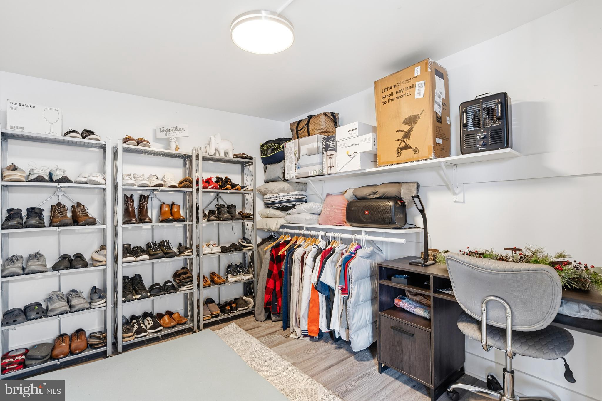 552 48th Street Baltimore, MD 21224 - Photo 25 of 29 a view of walk in closet with clothes and shoes
