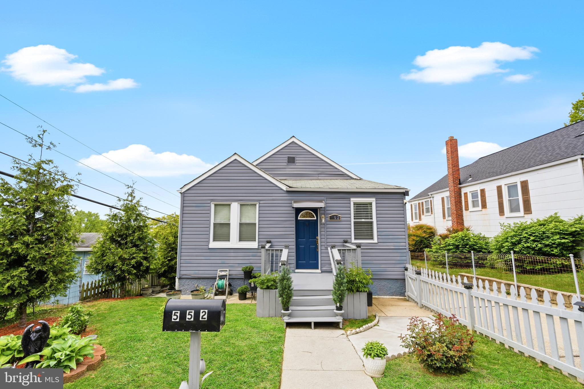 552 48th Street Baltimore, MD 21224 - Photo 4 of 29 a front view of a house with garden