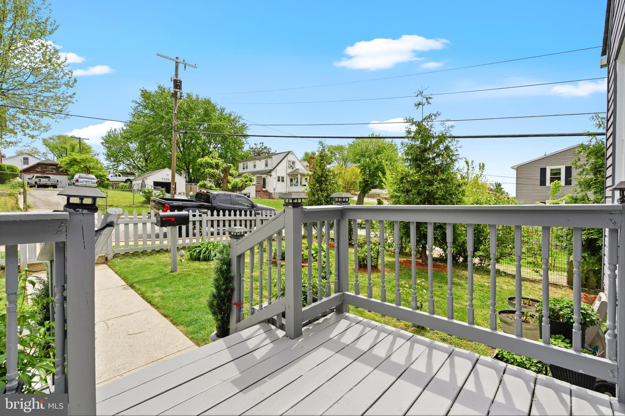 552 48th Street Baltimore, MD 21224 - Photo 5 of 29 a view of a house with a small yard and potted plants