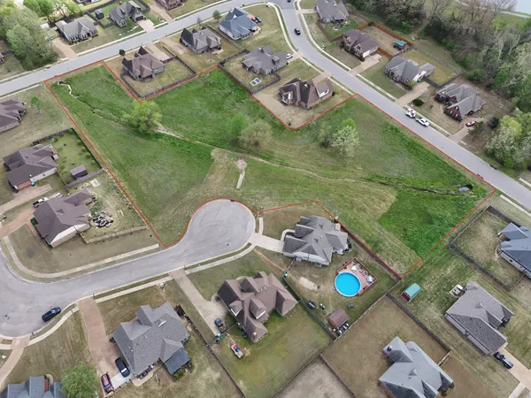 an aerial view of a house with a ocean view