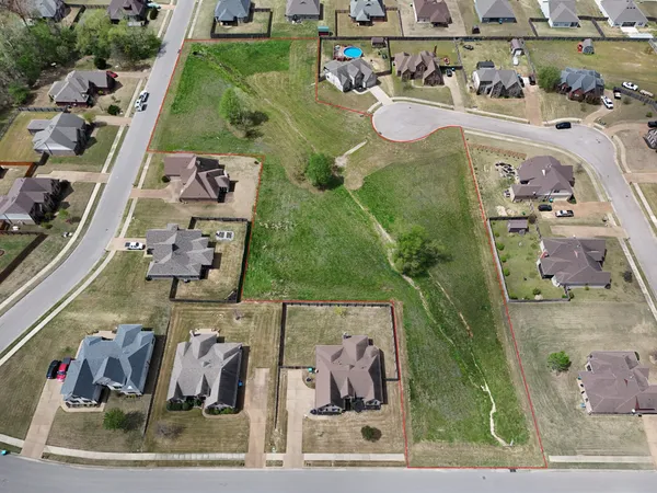 an aerial view of a house with outdoor space
