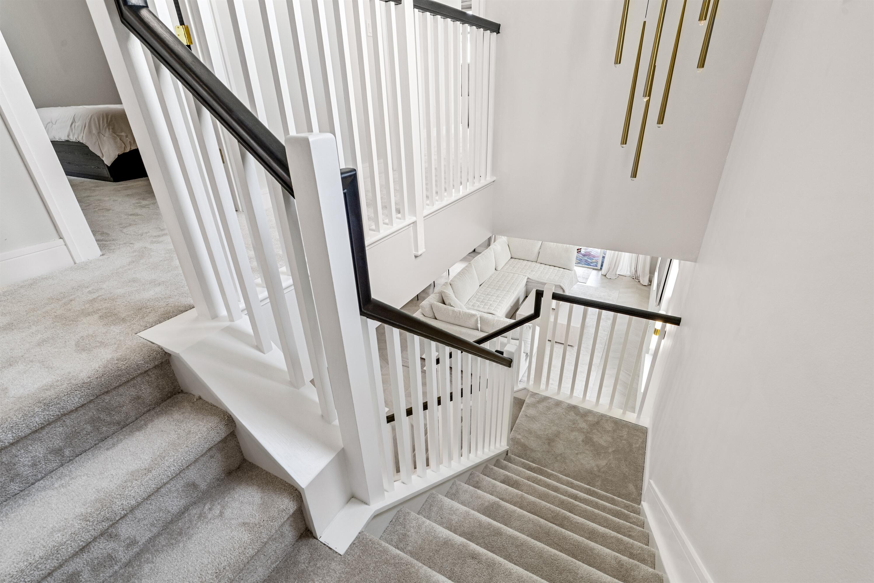 1570 Northwest 48th Place Boca Raton, FL 33431 - Photo 15 of 30 a view of staircase with railing and white walls