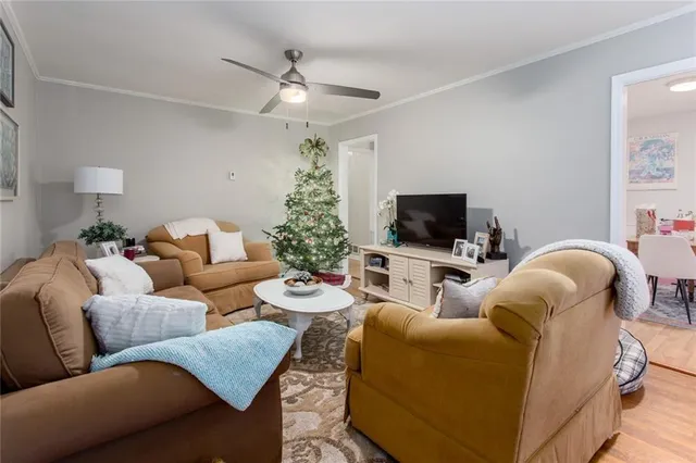 a living room with furniture and a flat screen tv