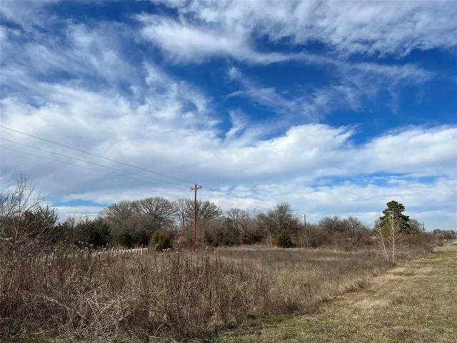 a view of a lake with a big yard
