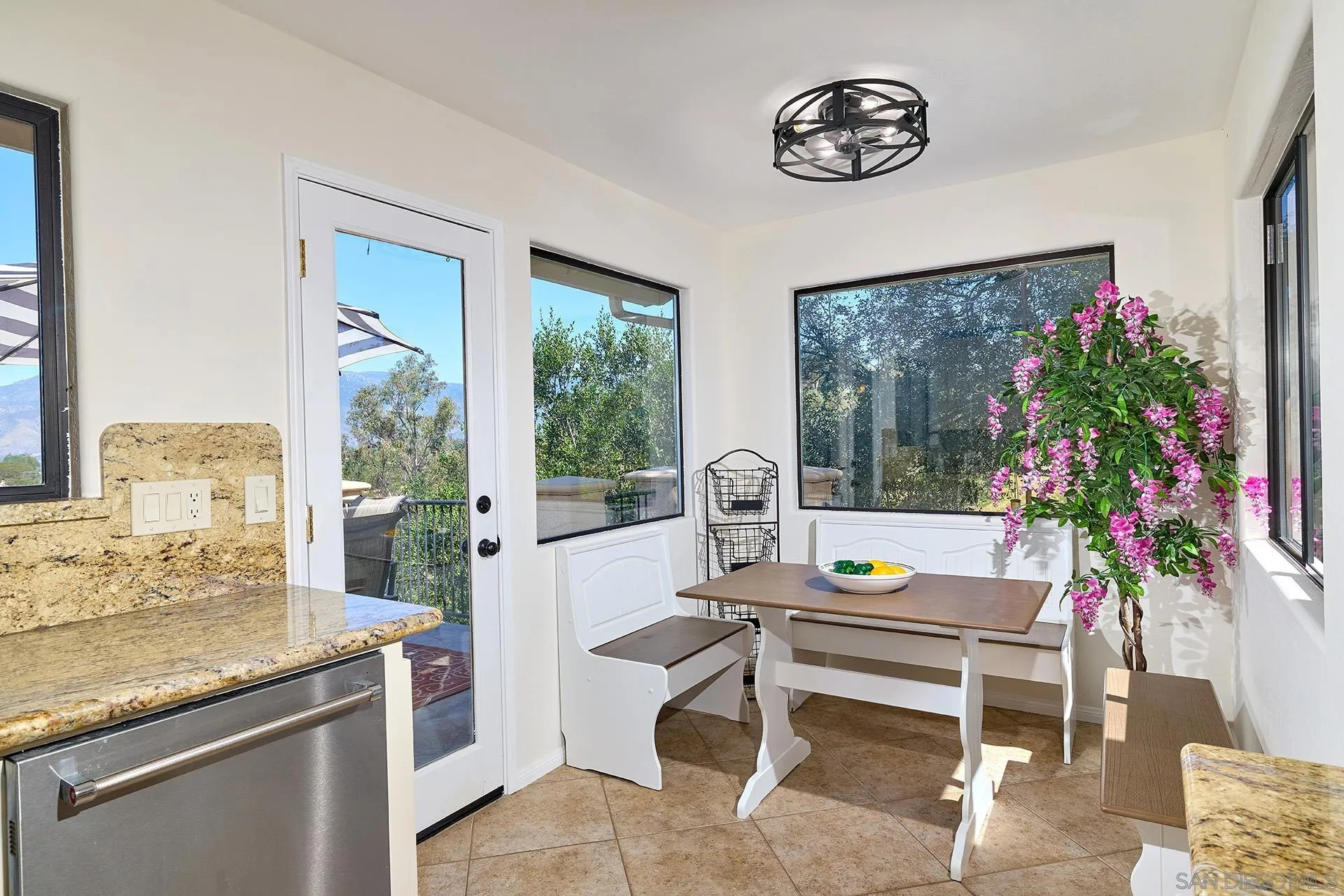 13588 McNally Road Valley Center, CA 92082 - Photo 12 of 43 a living room with furniture and a potted plant
