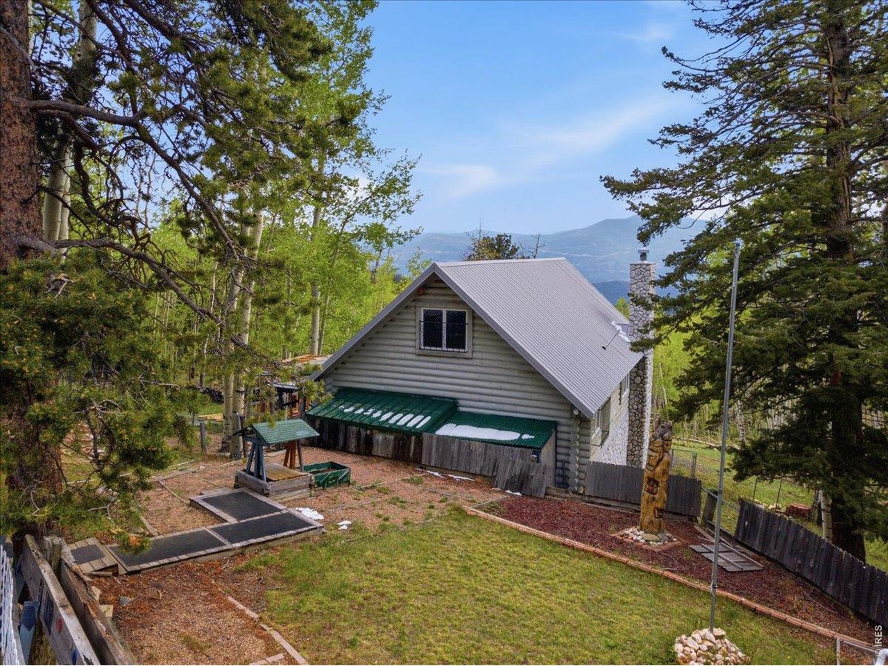1800 Robinson Hill Road Black Hawk, CO 80422 - Photo 8 of 30 a front view of a house with garden