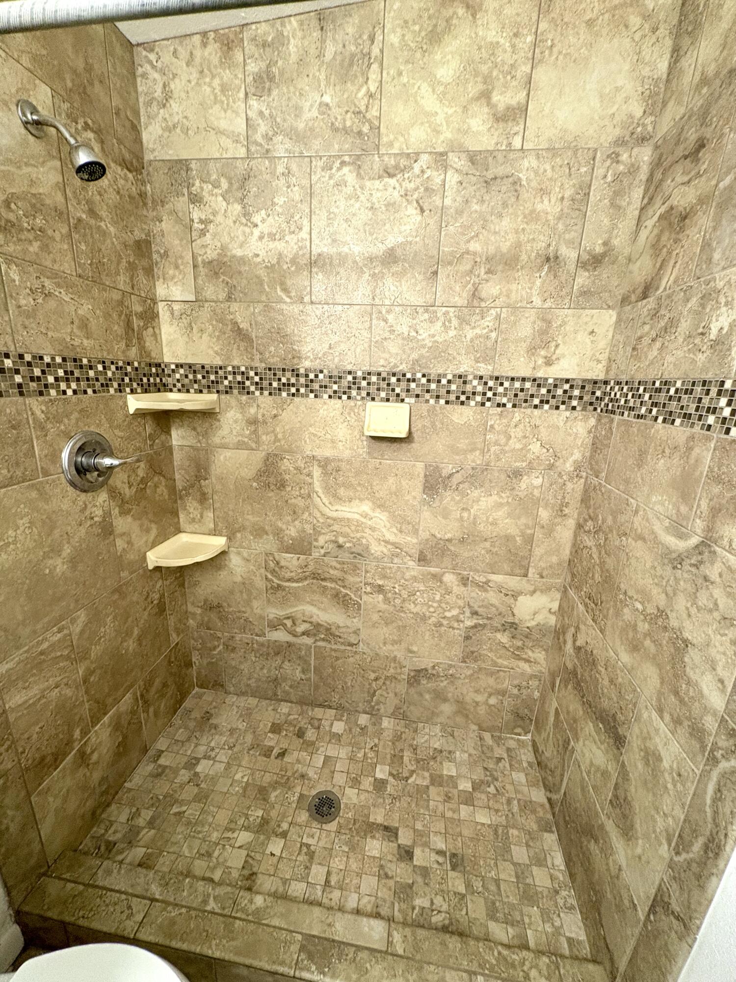 4618 44th Street Lubbock, TX 79414 - Photo 14 of 21 a bathroom with a shower